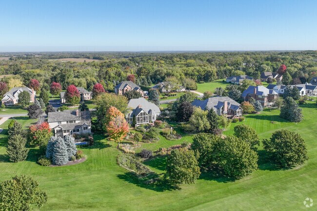 Row of homes showing the golf course as a backyard within Boone Creek Golf Club in Bull Valley.
