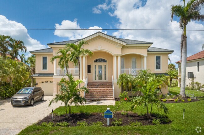 Stately two story homes line the streets in the Middle Gulf Drive neighborhood.