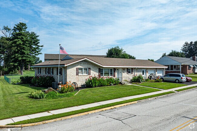 This single-story ranch home offers classic curb appeal and easy suburban living.