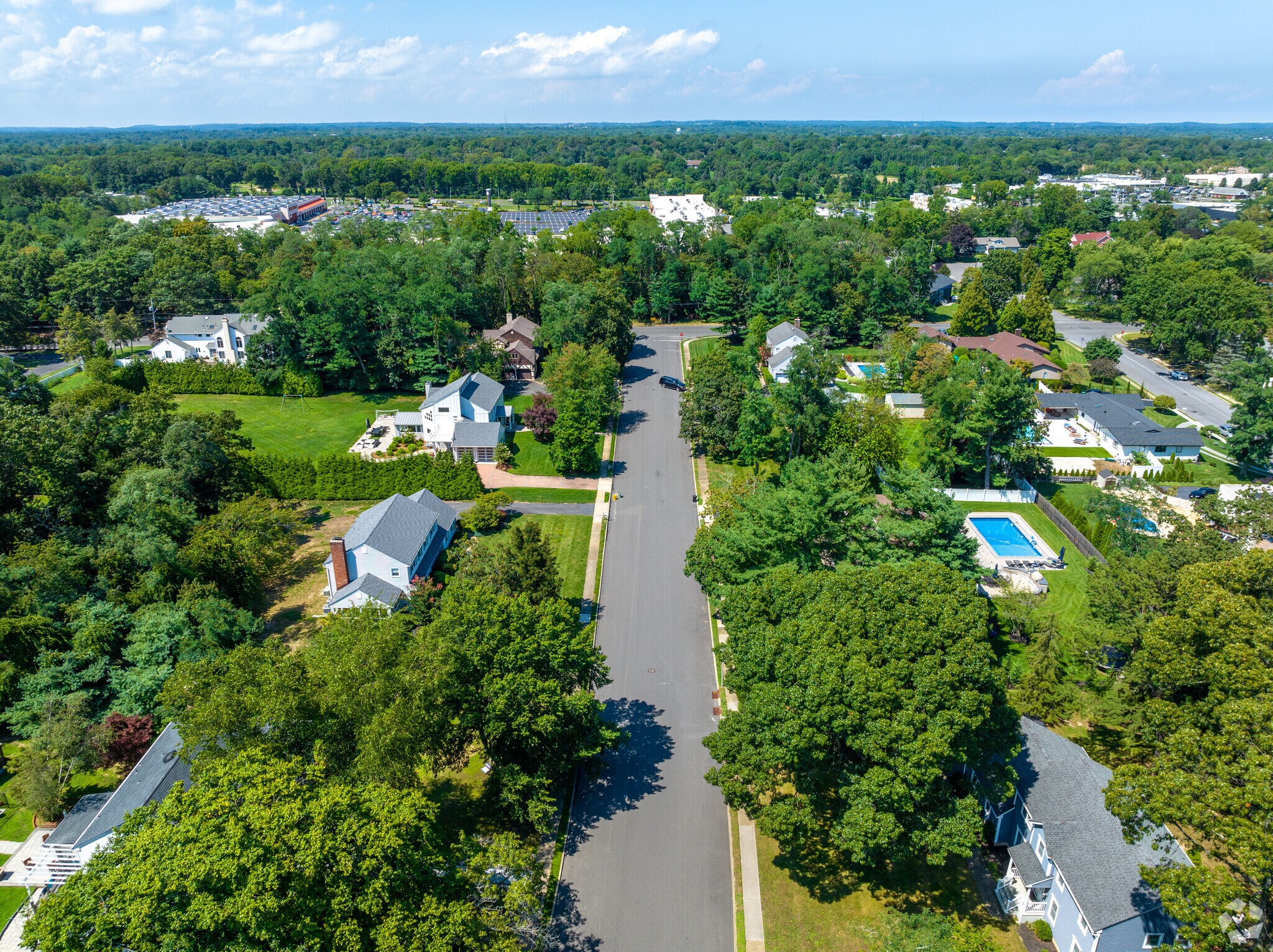 Mature tree lined streets with paved driveways are typical in West Long Branch.