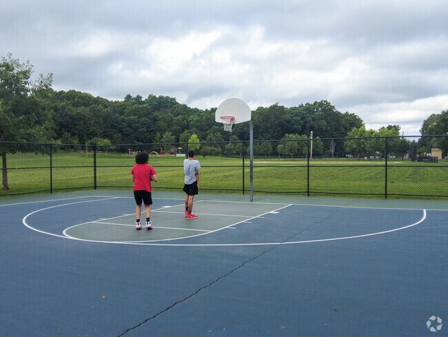 Neighbors in Mount Washington shoot hoops.