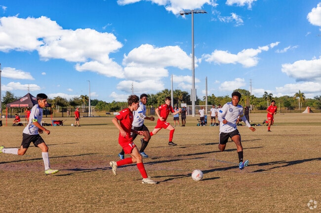Valencia Isles local players go all out during a soccer game at Canyon District Park.