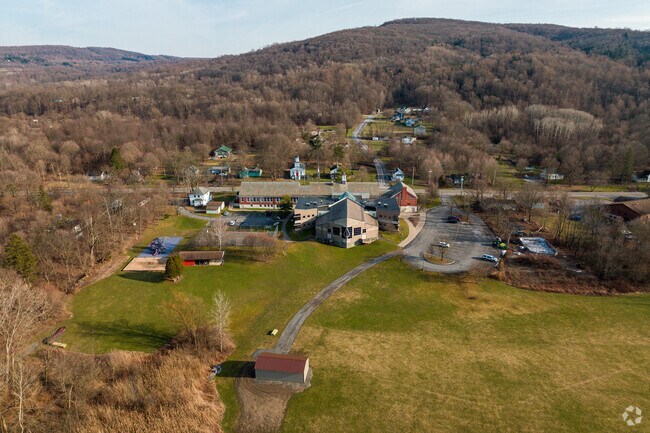 The rolling hills can be seen behind The Onondaga Nation School in the Onondaga Nation.