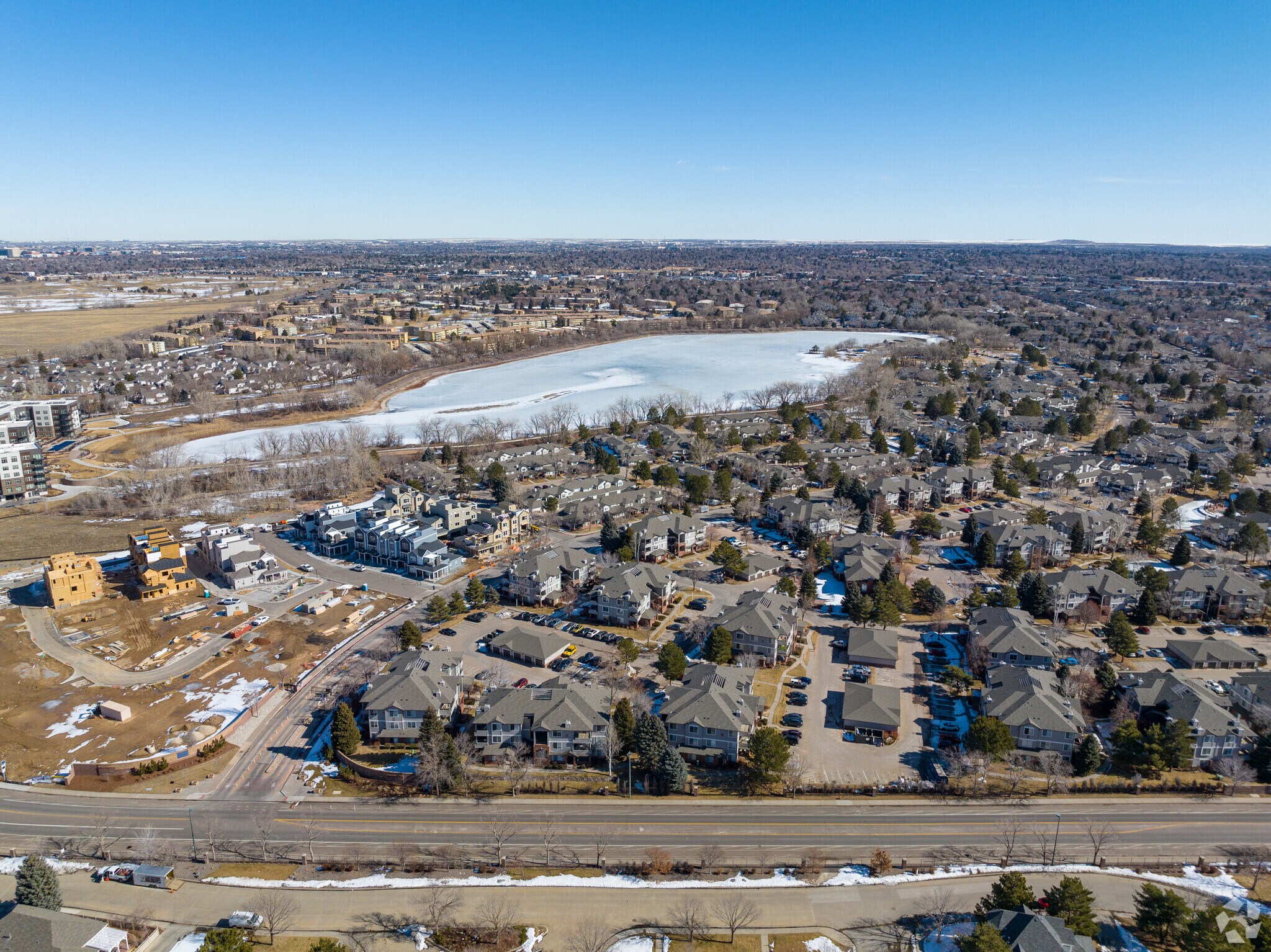 Houses surrounding lake wide context