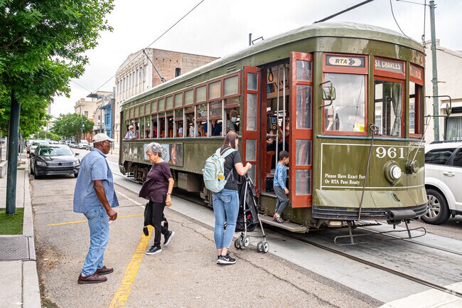 Tourists and residents use the iconic streetcar in the Warehouse District.