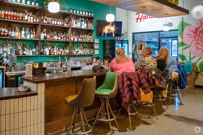Oak Park has several gathering places, including Mother Hansome a pizza place and bar .