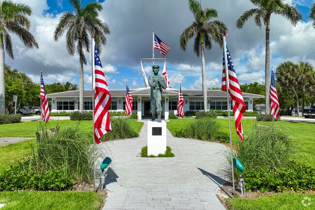 Capture a moment with The Barefoot Mailman Statue near  Deerfield Beach.