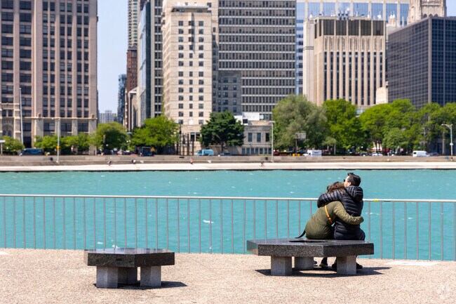 Couples embrace and take in the view at Milton Lee Olive Park.