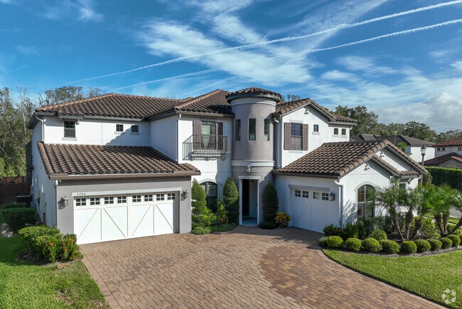 This beautiful Spanish revival home is located in the community of Heathrow.