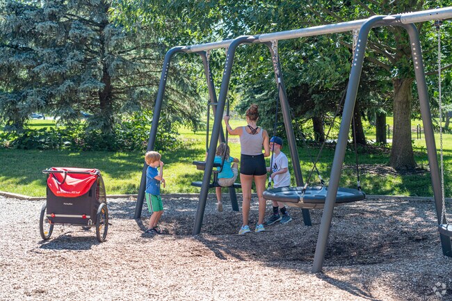 A Hobson West family enjoy the playground at Naperville's Gartner Park.