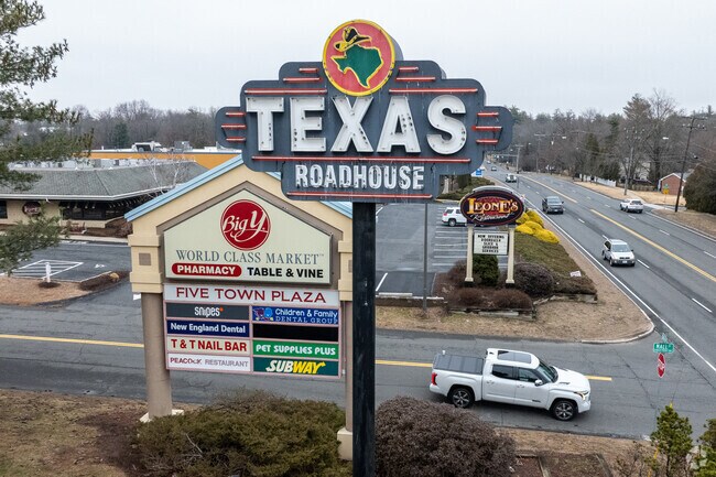 The signs greet shoppers to Five Star Plaza in Springfield.