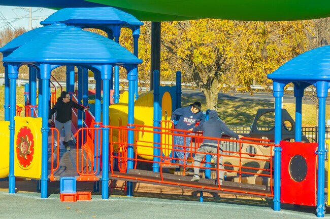 Kids enjoy the shaded playground at Bristol Township Park.