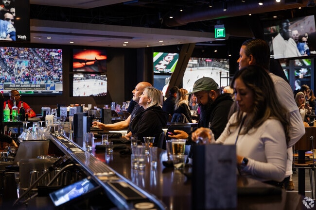 Tom's Watch Bar displays all popular sports games for visitors near Meadows Village.