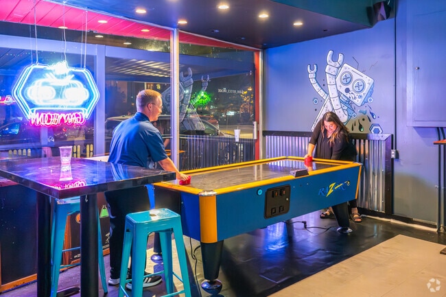 For a night out with friends, 12 Points residents grab a drink and play games at Bar_Botics.
