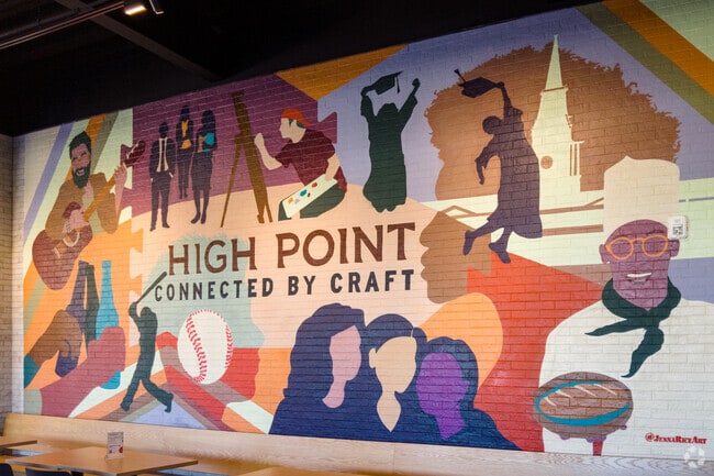 A vibrant mural decorates the interior of Assembly Full Hall in Greater High Point.