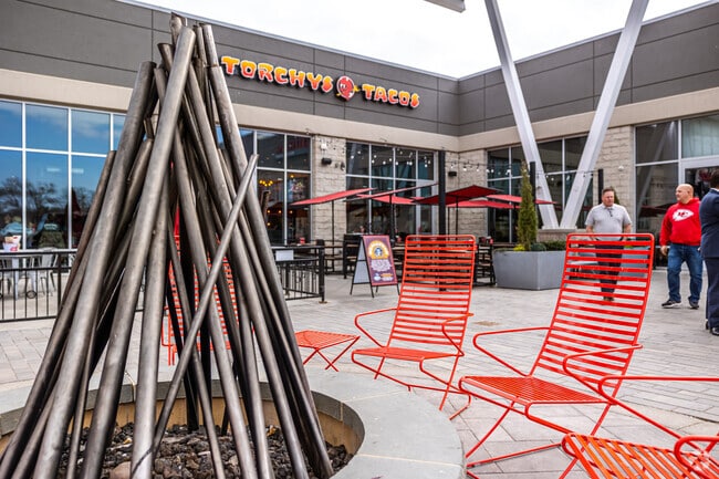 Sit and relax with food by a bonfire at Ward Parkway Center.