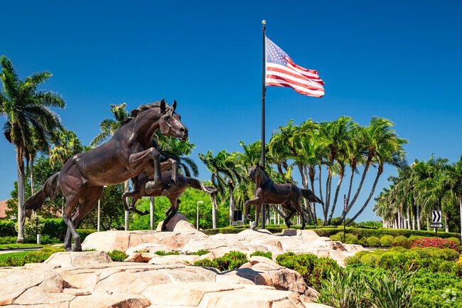 Lely Resort is marked by a flag and prominent statues at each entrance.