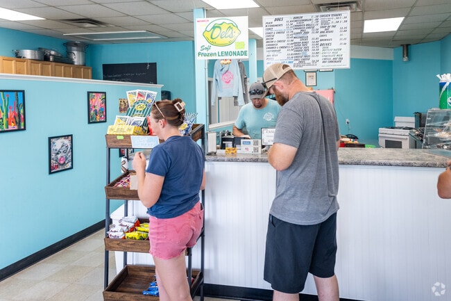 Savor hot dogs paired with Del's lemonade at County Fare Too Coney Island in North Swansea, MA.