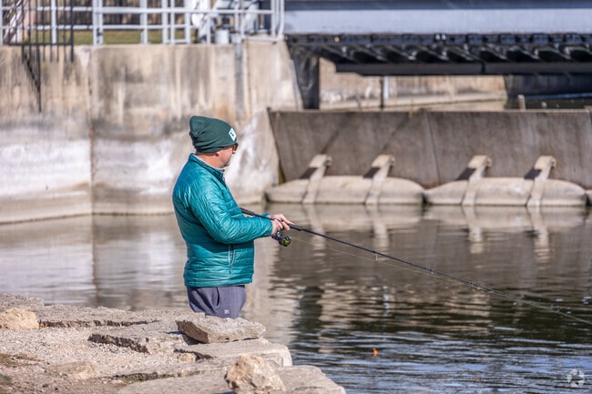 Residents of Merrill Algonquin Hills take their fishing pole to Cornish Park to relax.