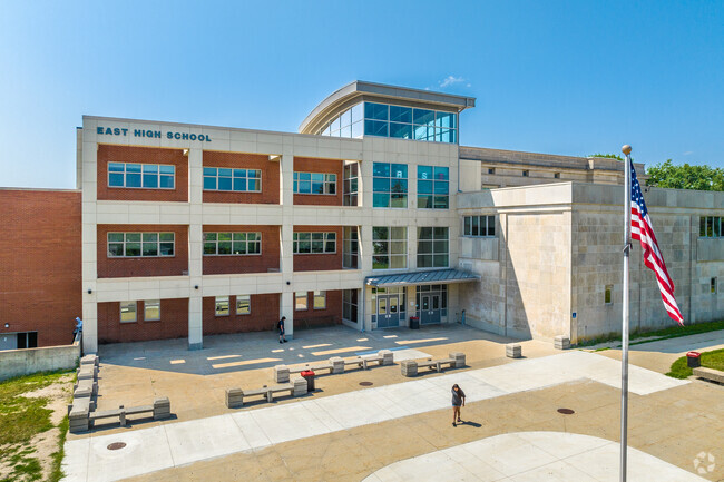 The newer entrance of East High School emulates the columns of Capitol Park, IA.