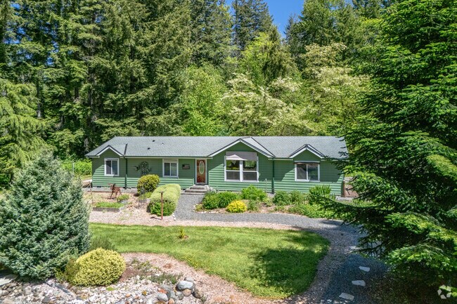 Enjoy a morning cup of coffee surrounded by nature in a Sisco Heights manufactured home.