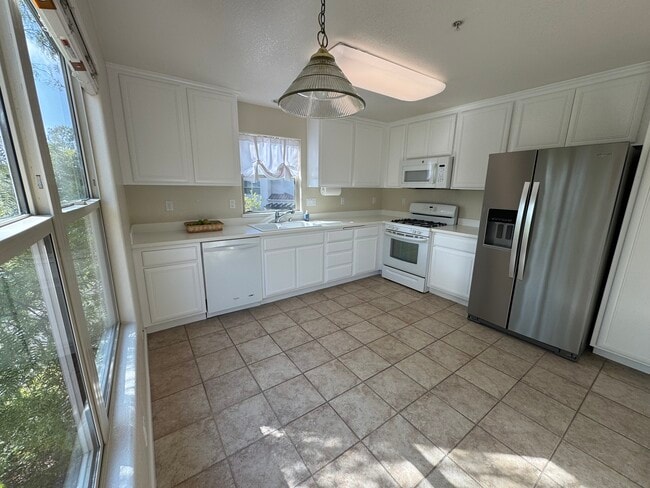 spacious, freshly painted kitchen. Refrigerator has exterior water & ice