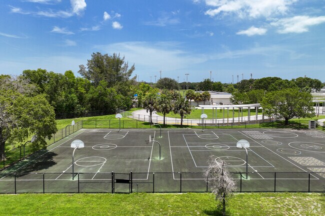 Students can play basketball during recess at Royal Palm School.