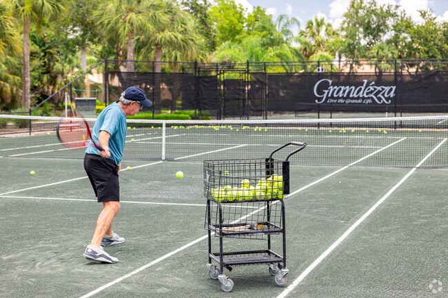 Grandezza tennis players enjoy practicing their shot on the club courts.
