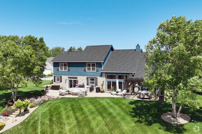 A variety of home styles sit on the water in the Keystone at the Crossing neighborhood.