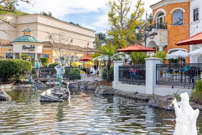 Enjoy a nice day outdoors at the Calabasas Commons, where locals can sit by a flowing pond.