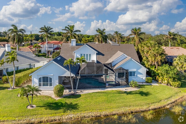 Pelican Marsh homes often have an attached, screened in pool in the backyard.