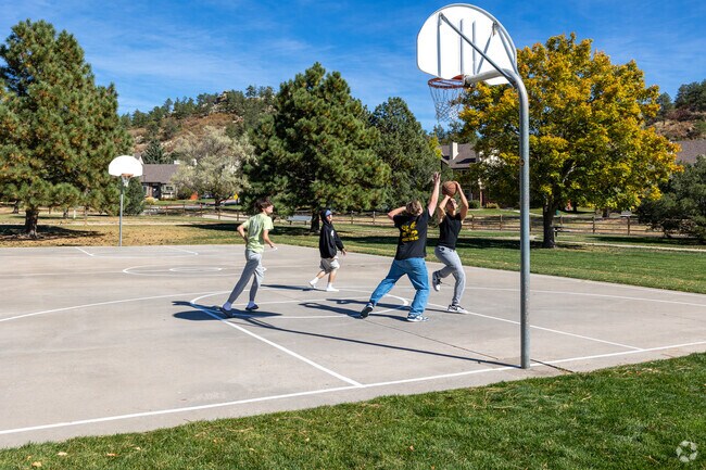 Enjoy playing a game of basketball with your friends at Pinon Valley Park.