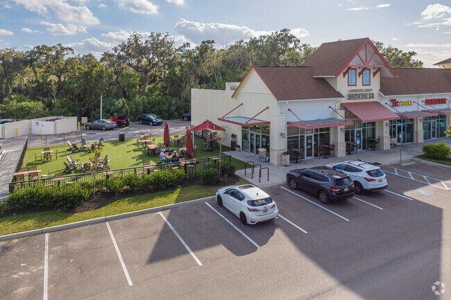 Corporate Ladder offers outdoor seating for beer lovers accompanied by a furry friend.