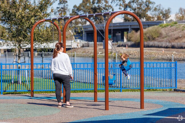 Get some swings in at the playground by the channel and Long Beach Bikeway Route 10.