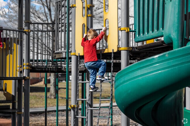 Kids living in Crown Heights can climb on the playground at Edgemoore Park.