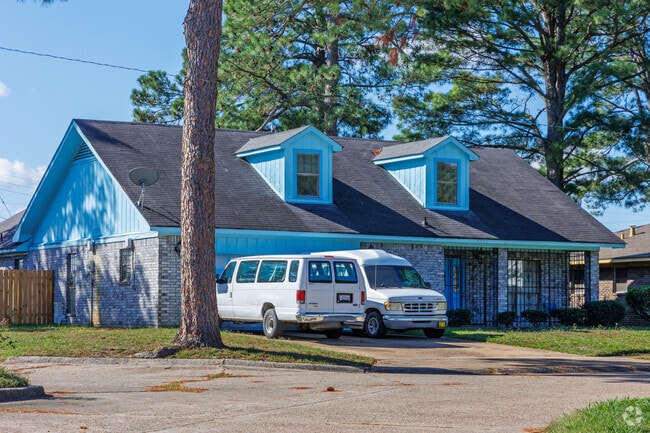 Two-story gabled homes with wide driveways stand in Mooretown and Hollywood Heights.