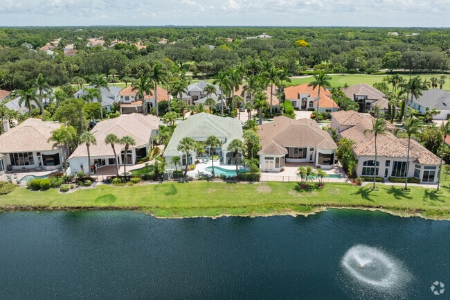 Mediterranean-style homes with water views line the streets of Addison Reserve.