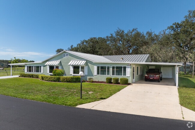 Large waterfront homes in Maranatha Village have custom roof lines and open car ports.
