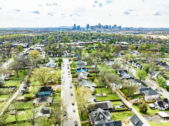 Talbot's Corner rooftops stretch toward downtown Nashville’s high-rises.