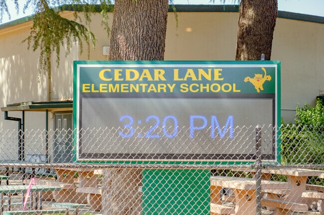 Important information can be found at the entrance sign of Cedar Lane Elementary School.