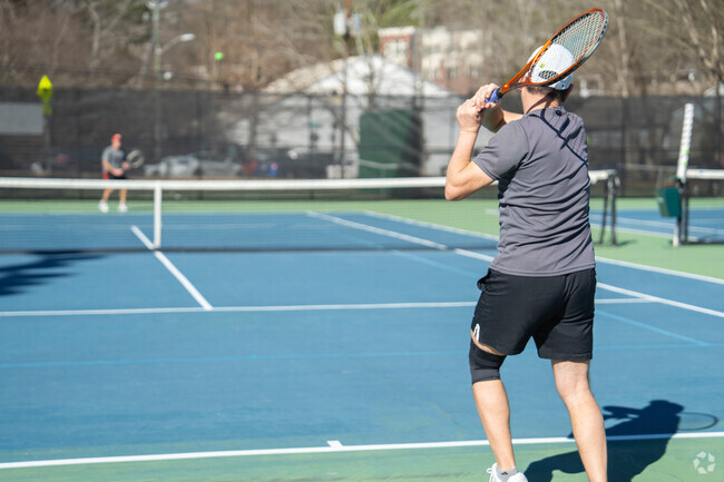 In the quaint community of Mountaire Springs, residents eagerly fill their sun-drenched afternoons on the public tennis courts, where the rhythmic sound of rackets striking balls fills the air, and laughter and friendly banter create an inviting atmosphere.