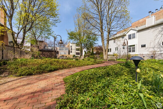 A walking path winds through West Graceland's Warner Garden Park.