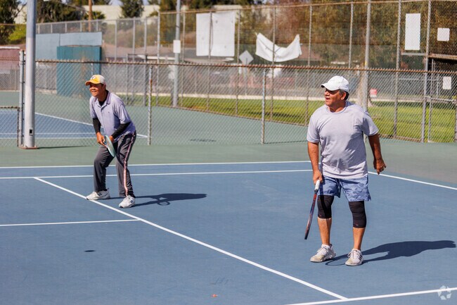Addams residents enjoy playing tennis at Scherer Park, a local recreational spot.