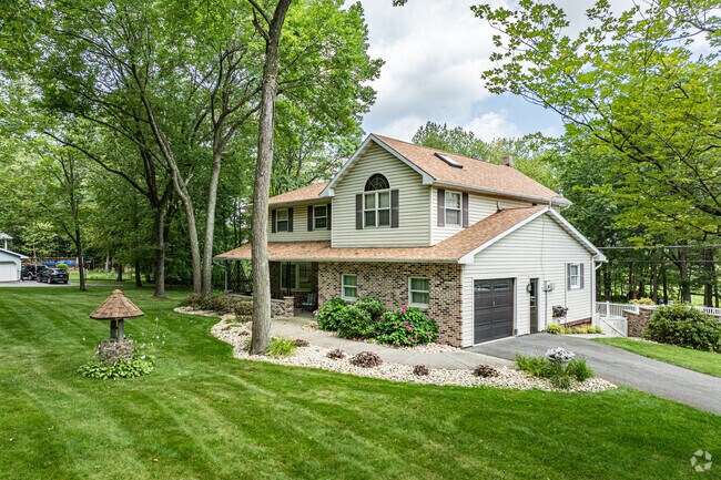 Bi-level homes often feature garages and spacious lawns.