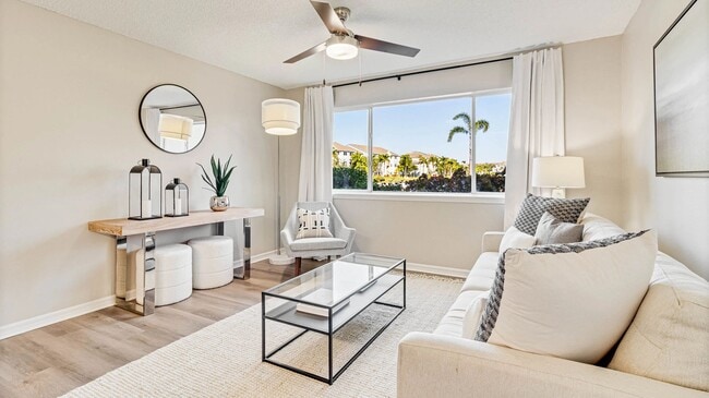 Bright living spaces with large windows and cheerful ceiling fans for an uplifting vibe.