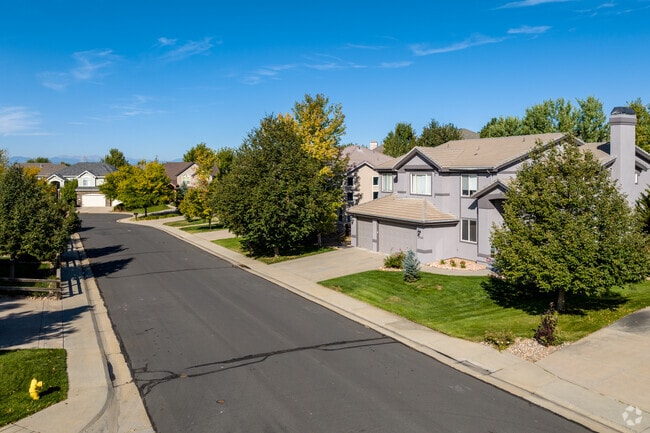 Pastel-colored mansion homes can be spotted in The Farm-Arapahoe.