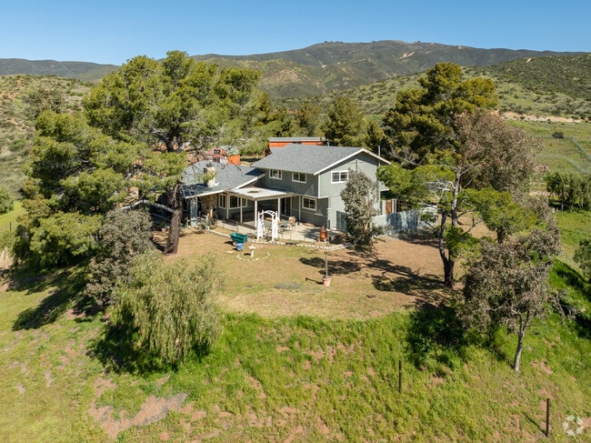 A modern multi-level home sits on top of a hill in Agua Dulce.