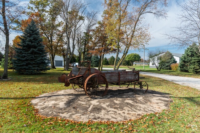 Antique farm equipment is displayed proudly outside of a Kankakee home.