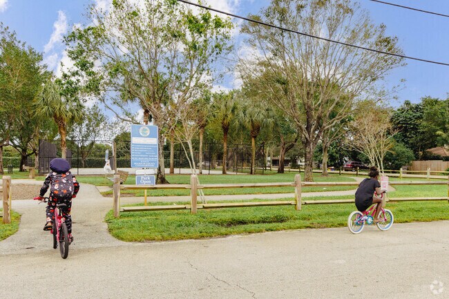 Children riding their bikes near Old Oak park.