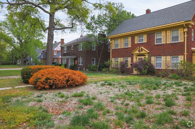 Row of red brick homes with unique accent colors in College Hill.